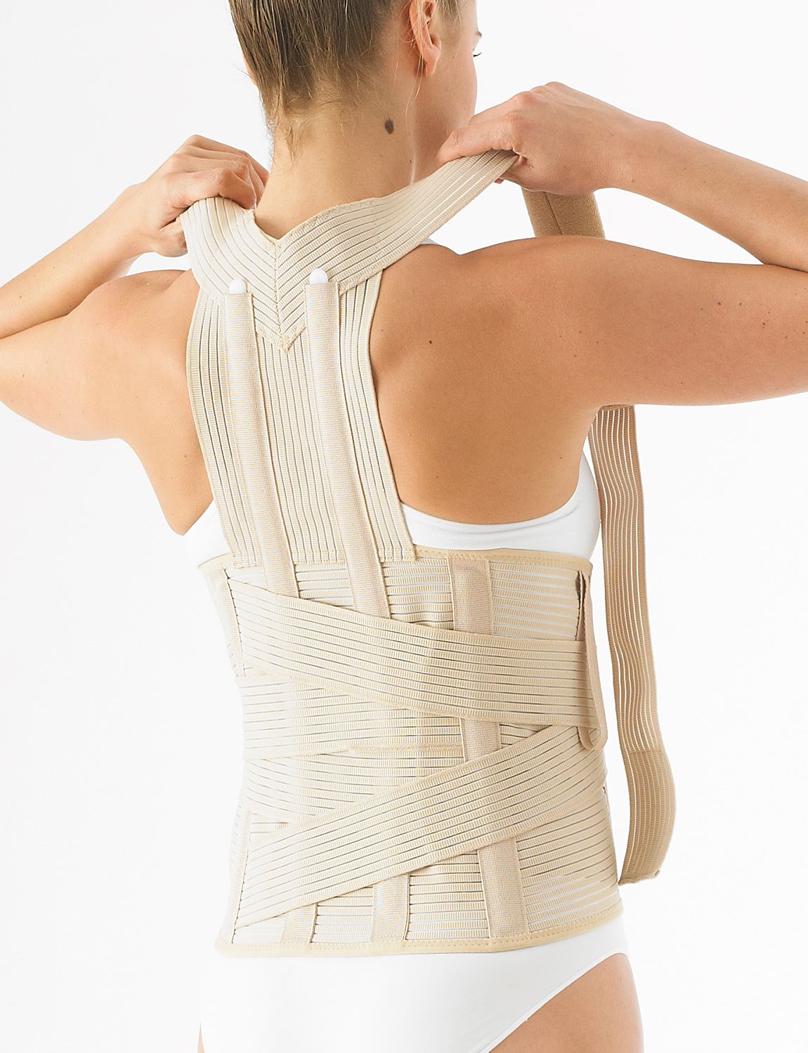 Woman wearing Neo G Dorsolumbar Support/Brace facing back, highlighting adjustable straps on the shoulders