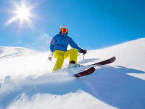 A man skiing down a mountain side