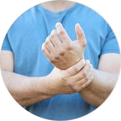 Man holding wrist in pain